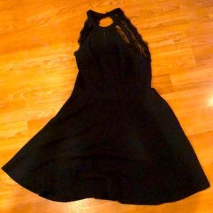 Black halter neck dress with lace back opening